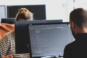A person doing coding on the screen