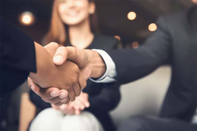 Two professionals shaking hands