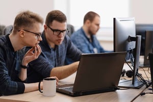 Team working on an IT issue related to education