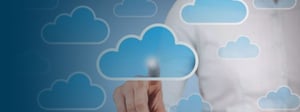 Person interacting with a digital cloud icon interface, representing cloud computing and online data services.