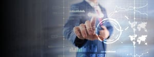 A business professional interacting with a digital dashboard displaying charts, analytics, and global data, representing managed IT services, performance monitoring, and data-driven decision making.