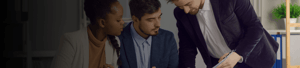 A mortgage officer is going over paperwork with a couple