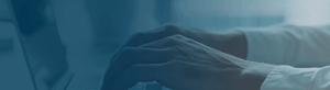 Hands typing on a keyboard