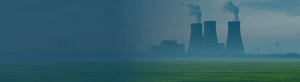 An image of an energy plant with three towers that have smoke coming out